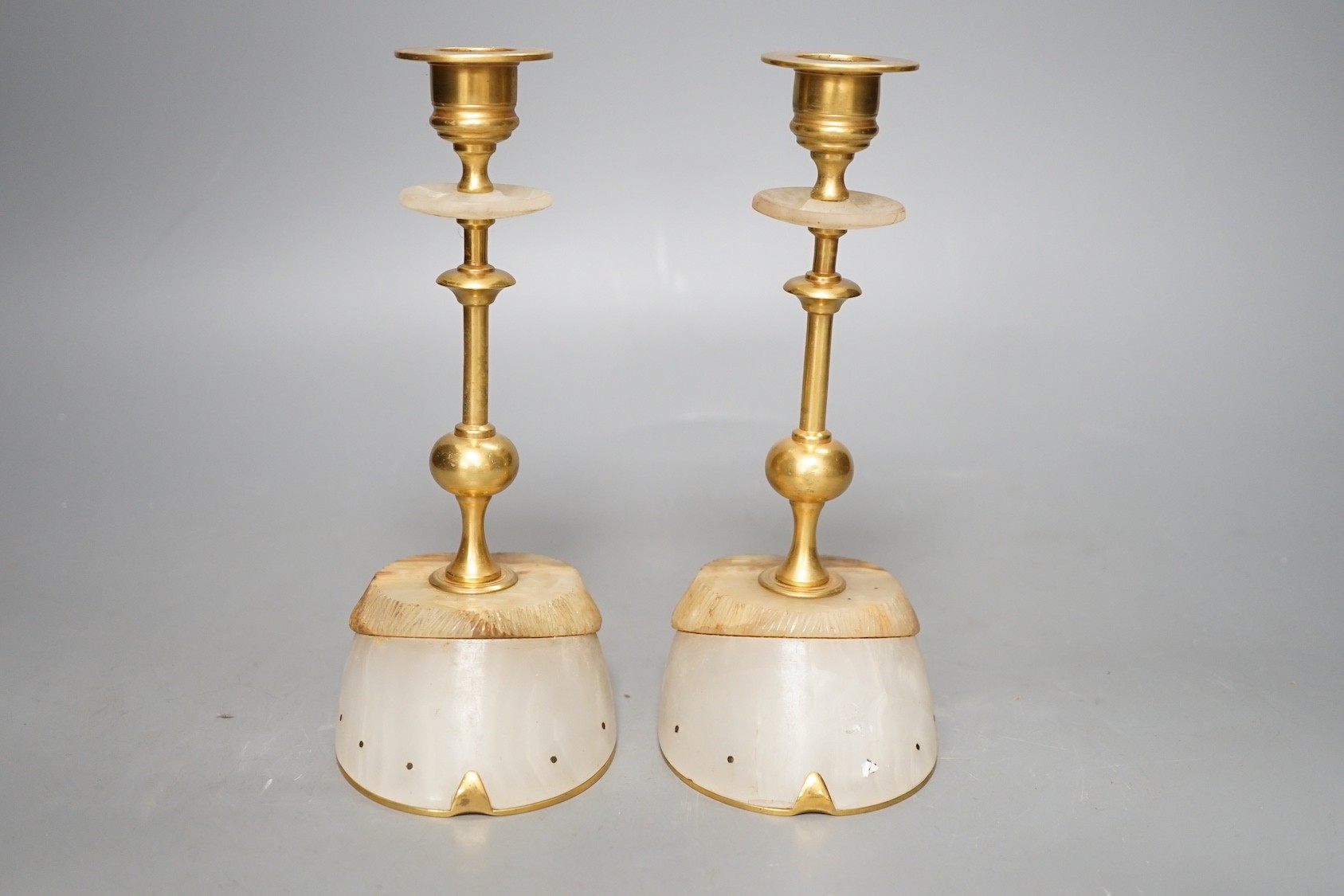 A pair of gilt metal and hardstone 'hoof' candlesticks, 19cm